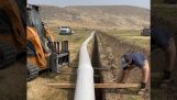 Installation rapide d'un pipeline dans un fossé