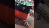A ship enters the water for the first time