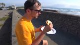 Enjoying a sandwich by the sea