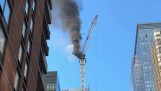 A crane catches fire and collapses (New York)